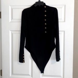Black ribbed mock turtleneck bodysuit.
